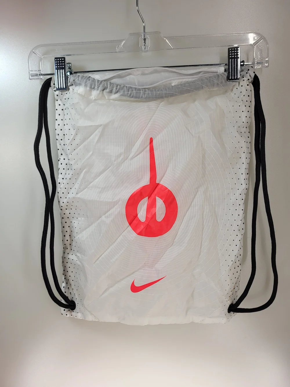Nike White Drawstring Backpack with Red Logo and Black Accents